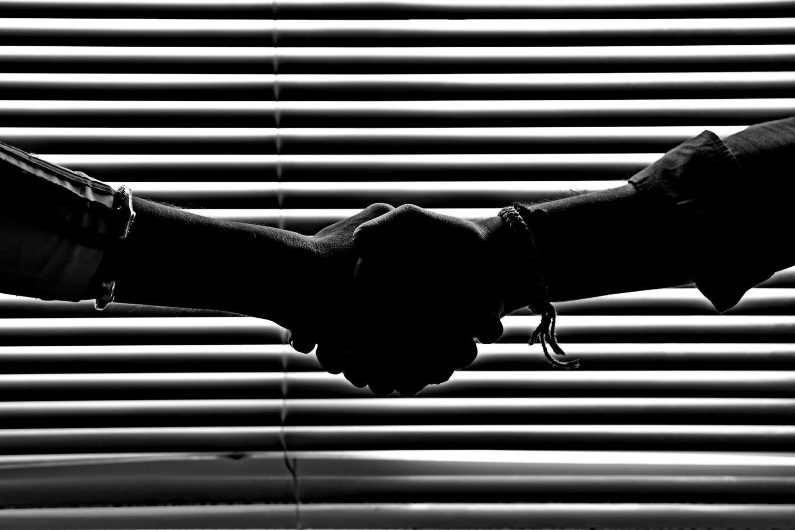 Increasing revenue from MVNO partners 1 Silhouette of two people shaking hands symbolizing partnership and trust.