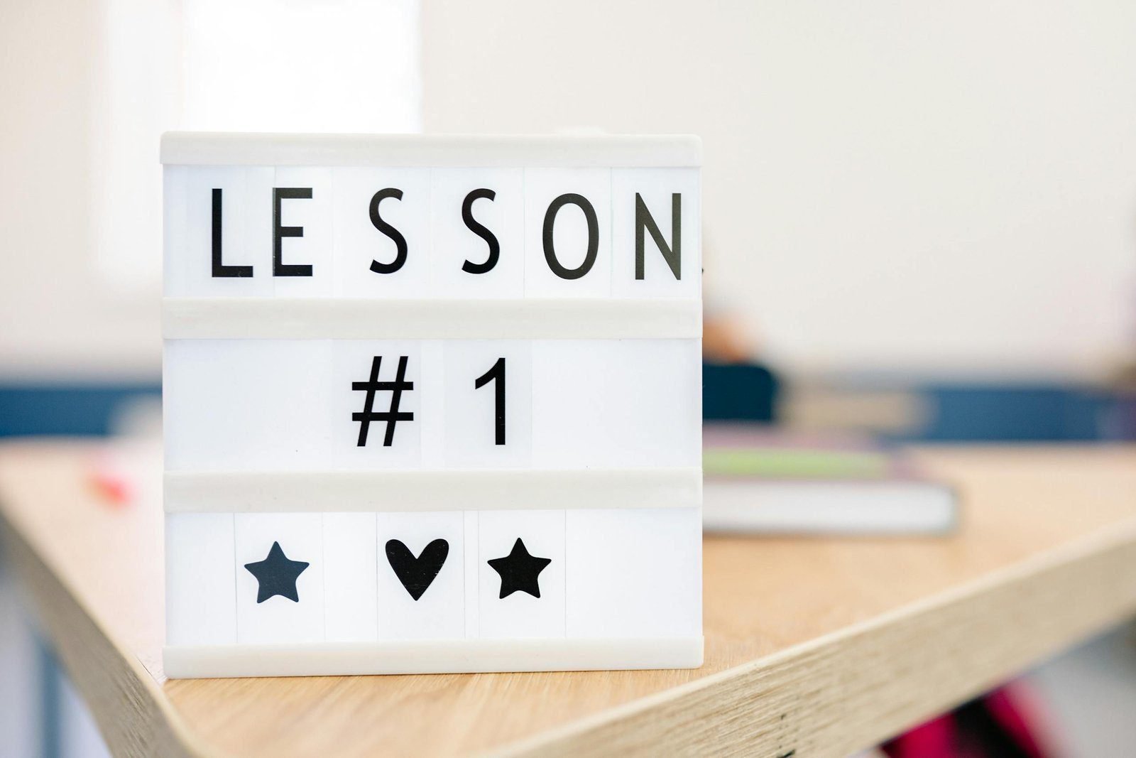 Be Profitable From Day One 1 Lightbox sign displaying 'Lesson #1' in a classroom setting, symbolizing education and new beginnings.